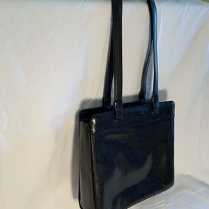Proton black leather shoulder bag. Bag size 10x10”